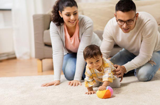 Family playing with baby. Four reasons to re-evaluate your life insurance needs