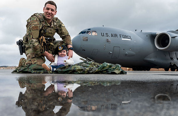 USBA celebrates military kids, father and daughter in front of Air Force plane