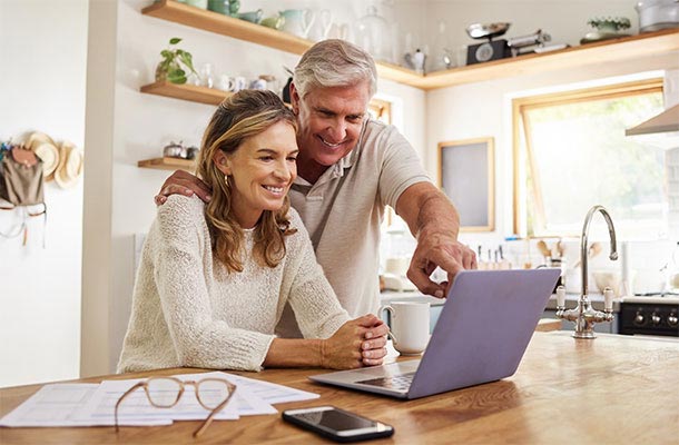 USBA life insurance beneficiary - man and woman looking at computer