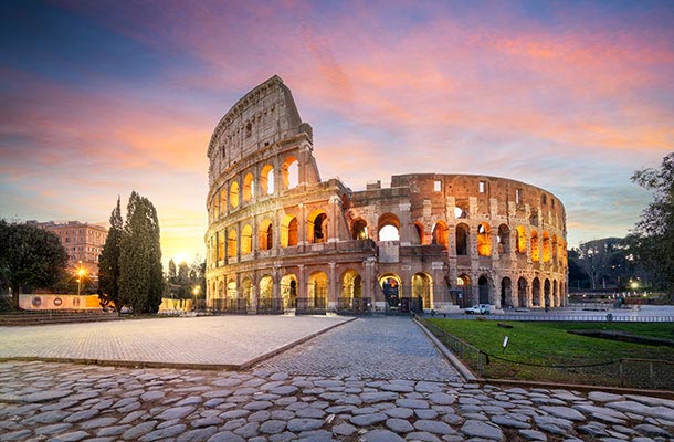 The Roman Colosseum at sunrise-representing the ancient roots of life insurance dating back to burial clubs in Rome